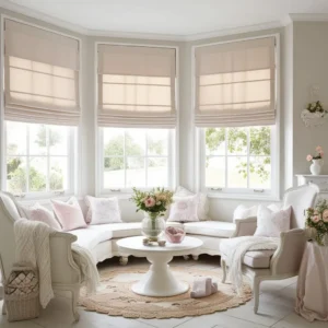 Neutral beige and grey window treatment materials styled for a minimalist small living room.